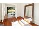 Well-lit exercise room featuring hardwood floors, a large mirror, and access to the outdoors at 818 Springdale Ne Rd, Atlanta, GA 30306