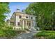 Beautiful home with stately columns and lush green surroundings offers a tranquil and inviting atmosphere at 818 Springdale Ne Rd, Atlanta, GA 30306