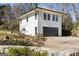 Charming two-story guesthouse with a two-car garage and lush landscaping at 818 Springdale Ne Rd, Atlanta, GA 30306