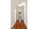 Bright hallway features hardwood floors, neutral walls, and elegant lighting fixtures at 818 Springdale Ne Rd, Atlanta, GA 30306