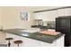 Compact kitchenette with white cabinets, and black appliances at 818 Springdale Ne Rd, Atlanta, GA 30306
