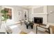 Bright living room boasts a fireplace, neutral tones, and elegant furnishings creating a cozy ambiance at 818 Springdale Ne Rd, Atlanta, GA 30306