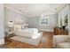 Airy main bedroom with hardwood floors, light blue walls, and natural light at 818 Springdale Ne Rd, Atlanta, GA 30306