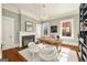 Inviting home office with a fireplace, built-in shelves, and ample natural light, ideal for productivity at 818 Springdale Ne Rd, Atlanta, GA 30306
