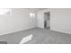 Bright bedroom features soft carpet, natural light, and an access door to another area at 455 Prescott Way, Villa Rica, GA 30180