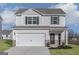 Charming two-story home with a two-car garage and a well-maintained lawn at 455 Prescott Way, Villa Rica, GA 30180