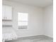 Bright kitchen features white cabinets, stone countertops, and a window with natural light at 455 Prescott Way, Villa Rica, GA 30180