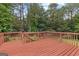 Spacious back deck with brown wood finish and railings, perfect for outdoor entertaining at 44 Willow Leaf Way, Sharpsburg, GA 30277
