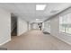 Large finished basement with carpet flooring and a staircase on the left at 44 Willow Leaf Way, Sharpsburg, GA 30277