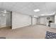 Spacious basement with carpet flooring and access to a bathroom at 44 Willow Leaf Way, Sharpsburg, GA 30277