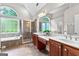 Bright bathroom featuring double vanity sinks, garden tub, and tiled walk-in shower at 44 Willow Leaf Way, Sharpsburg, GA 30277
