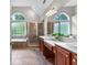 Bright bathroom featuring double vanity sinks, garden tub, and tiled walk-in shower at 44 Willow Leaf Way, Sharpsburg, GA 30277