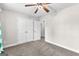 Bedroom featuring neutral walls, ceiling fan, and open closet at 44 Willow Leaf Way, Sharpsburg, GA 30277
