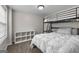 Bedroom features a bunk bed, a storage cabinet, and a large window at 44 Willow Leaf Way, Sharpsburg, GA 30277