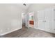 Bedroom with neutral carpet, two doors and open door to the bathroom at 44 Willow Leaf Way, Sharpsburg, GA 30277