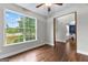 A bedroom with a window allowing natural light to fill the space at 44 Willow Leaf Way, Sharpsburg, GA 30277