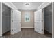 Bright bedroom featuring large open closets and a window for natural light at 44 Willow Leaf Way, Sharpsburg, GA 30277