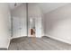 Bedroom with neutral carpet, two doors and view to the bathroom at 44 Willow Leaf Way, Sharpsburg, GA 30277