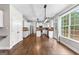 Bright kitchen featuring white cabinets, hardwood floors, and stainless steel appliances at 44 Willow Leaf Way, Sharpsburg, GA 30277