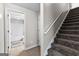 Carpeted staircase next to the entrance to a bathroom at 44 Willow Leaf Way, Sharpsburg, GA 30277