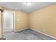 Empty storage room, cement floors, with yellow walls at 44 Willow Leaf Way, Sharpsburg, GA 30277