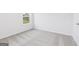 Neutral bedroom showcases carpeting, white walls, and a window at 256 Oliver Dr, Locust Grove, GA 30248