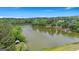 Serene aerial view of a lake, featuring a boathouse and lush greenery, creating a picturesque setting at 180 Lapis Lake Pt, Fayetteville, GA 30215