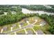 An aerial view showcasing the community nestled among the trees and overlooking a tranquil lake at 180 Lapis Lake Pt, Fayetteville, GA 30215