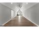 Spacious bonus room featuring vaulted ceilings, hardwood floors, ceiling fans and natural light at 180 Lapis Lake Pt, Fayetteville, GA 30215