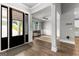 Welcoming foyer with natural light leads to a home office and open living space at 180 Lapis Lake Pt, Fayetteville, GA 30215