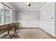 Home office with wainscoting, natural light and hardwood floors at 180 Lapis Lake Pt, Fayetteville, GA 30215