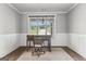 Bright home office featuring wainscoting, natural light, and hardwood floors at 180 Lapis Lake Pt, Fayetteville, GA 30215