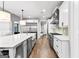A kitchen features a large island, stainless steel appliances, and hardwood floors at 180 Lapis Lake Pt, Fayetteville, GA 30215