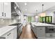 A spacious kitchen featuring stainless steel appliances, a large island, and an open concept design at 180 Lapis Lake Pt, Fayetteville, GA 30215