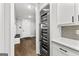 A mud room with a wine refrigerator, and built-in storage at 180 Lapis Lake Pt, Fayetteville, GA 30215