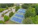 Overhead view of meticulously maintained tennis courts at 180 Lapis Lake Pt, Fayetteville, GA 30215