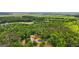 Expansive forest landscape with a red barn and a house nestled among dense trees at 75 Barber Rd, Carrollton, GA 30116