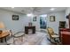 Finished basement area featuring a walk-in closet, ceiling fan, and a comfortable sitting area at 75 Barber Rd, Carrollton, GA 30116