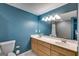 Modern bathroom with double sinks, a tile floor, ample counter space and a walk-in shower at 75 Barber Rd, Carrollton, GA 30116