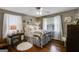 Cozy bedroom with wood floors, soft lighting, and windows dressed with elegant curtains at 75 Barber Rd, Carrollton, GA 30116