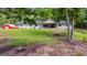 Charming single-story home with a well-manicured lawn and a detached red garage at 75 Barber Rd, Carrollton, GA 30116