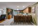 Well-equipped kitchen with wooden cabinets, bar seating, and stainless steel appliances at 75 Barber Rd, Carrollton, GA 30116