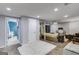 Inviting living space featuring plush seating, and an open layout with a view of the unfinished basement at 75 Barber Rd, Carrollton, GA 30116