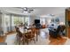 Open living space with hardwood floors, a dining area, and large windows at 75 Barber Rd, Carrollton, GA 30116