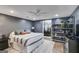 Main bedroom with an ensuite closet and dresser featuring a modern color scheme and ceiling fan at 75 Barber Rd, Carrollton, GA 30116