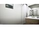 Modern bathroom with stylish vanity, framed art, and sleek glass-enclosed shower at 100 Grande Bishop Dr, Fairburn, GA 30213