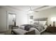 Comfortable bedroom with a ceiling fan, window, and ensuite bathroom at 100 Grande Bishop Dr, Fairburn, GA 30213
