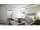 Comfortable bedroom with a ceiling fan, window, and ensuite bathroom at 100 Grande Bishop Dr, Fairburn, GA 30213