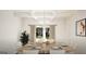 Cozy dining room with elegant chandelier and view to the backyard at 100 Grande Bishop Dr, Fairburn, GA 30213