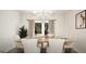 Elegant dining area with views of outdoor scenery and contemporary artwork at 100 Grande Bishop Dr, Fairburn, GA 30213